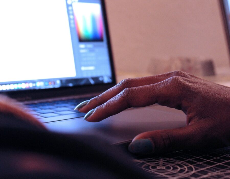 Designer's hands sketching brand ideas