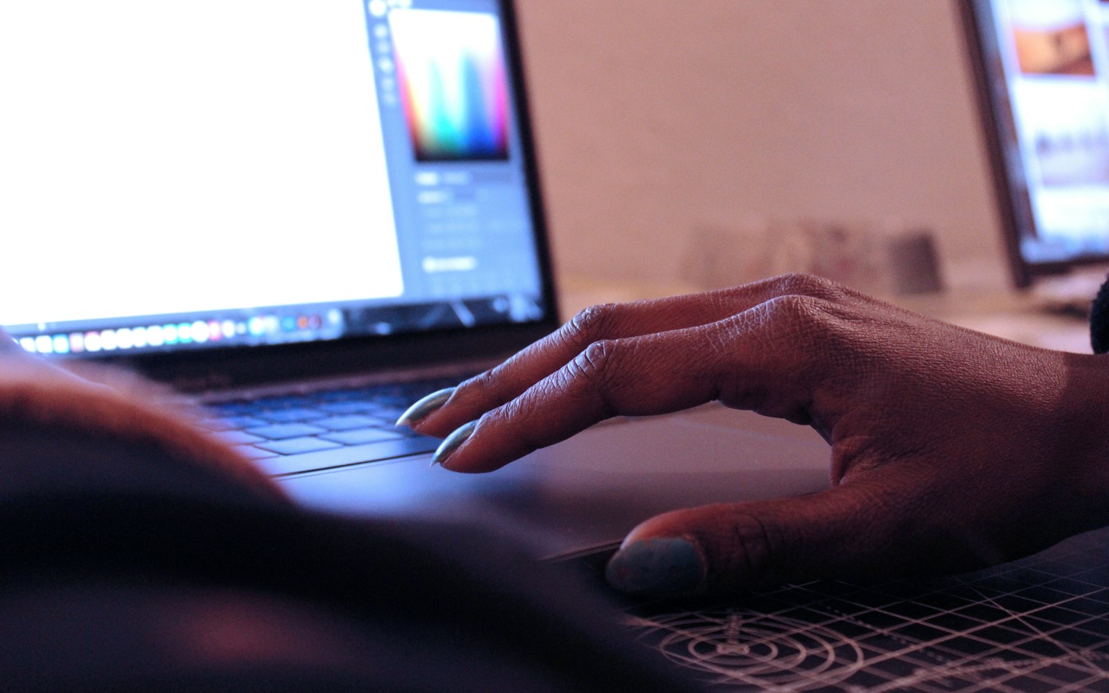 Designer's hands sketching brand ideas