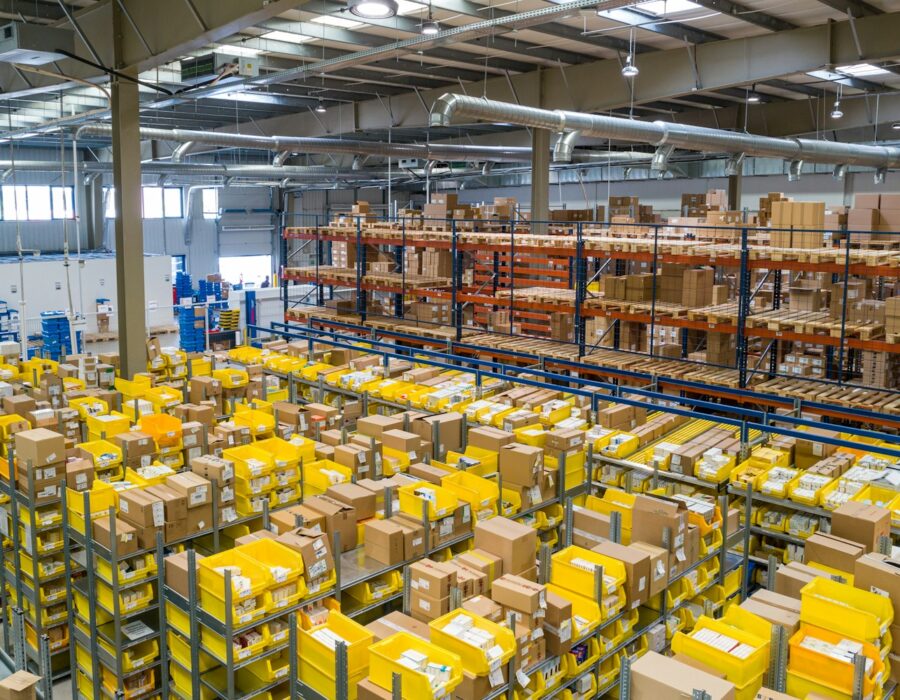 Warehouse shelves stacked with shipping boxes