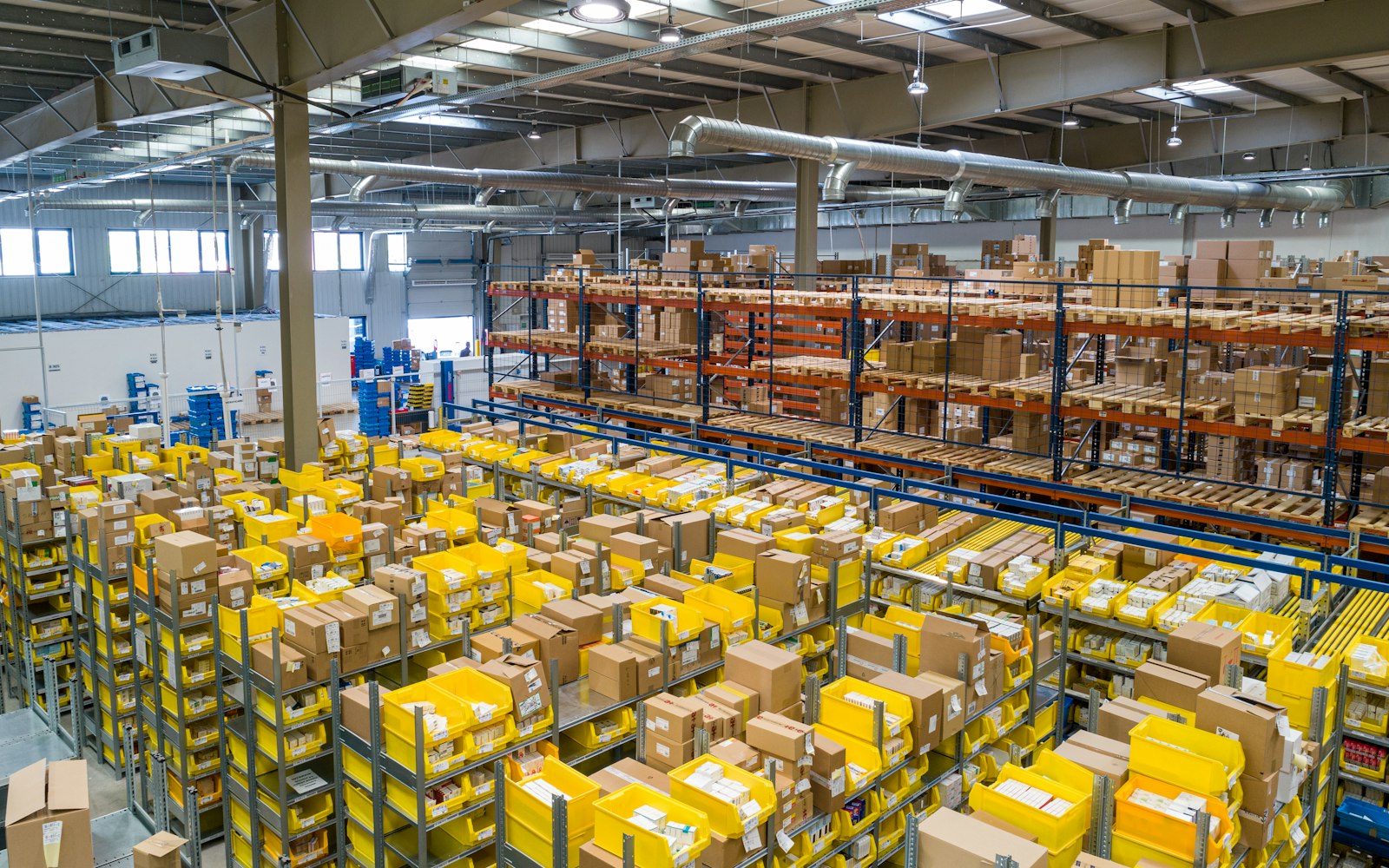 Warehouse shelves stacked with shipping boxes