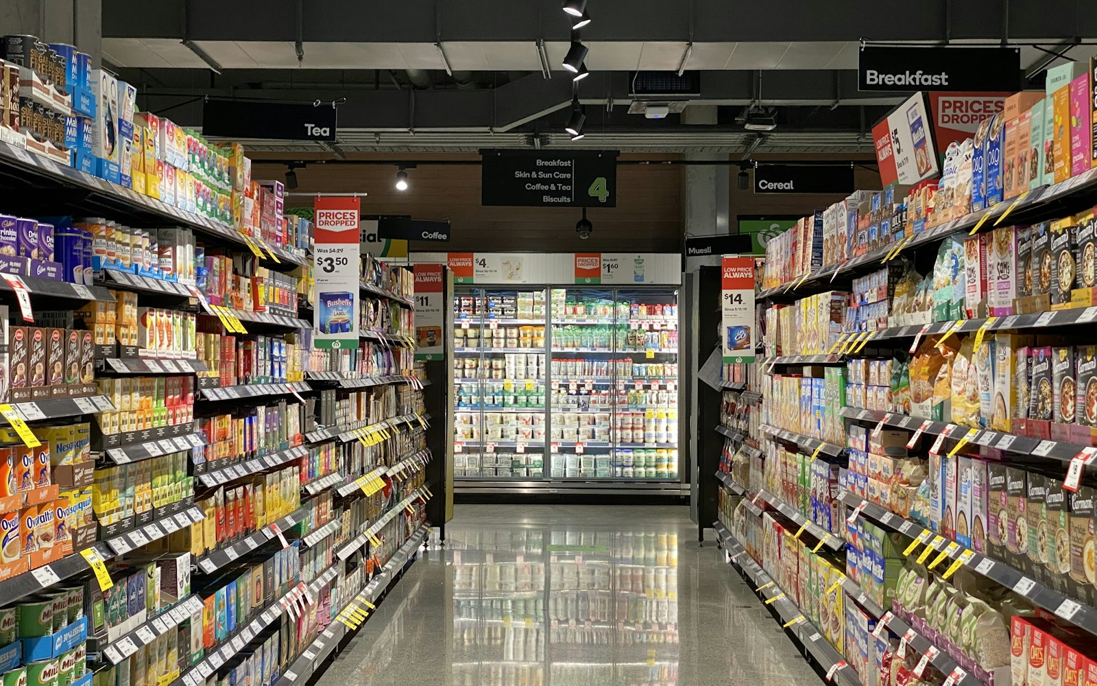 Supermarket aisle with packaged food products on shelves