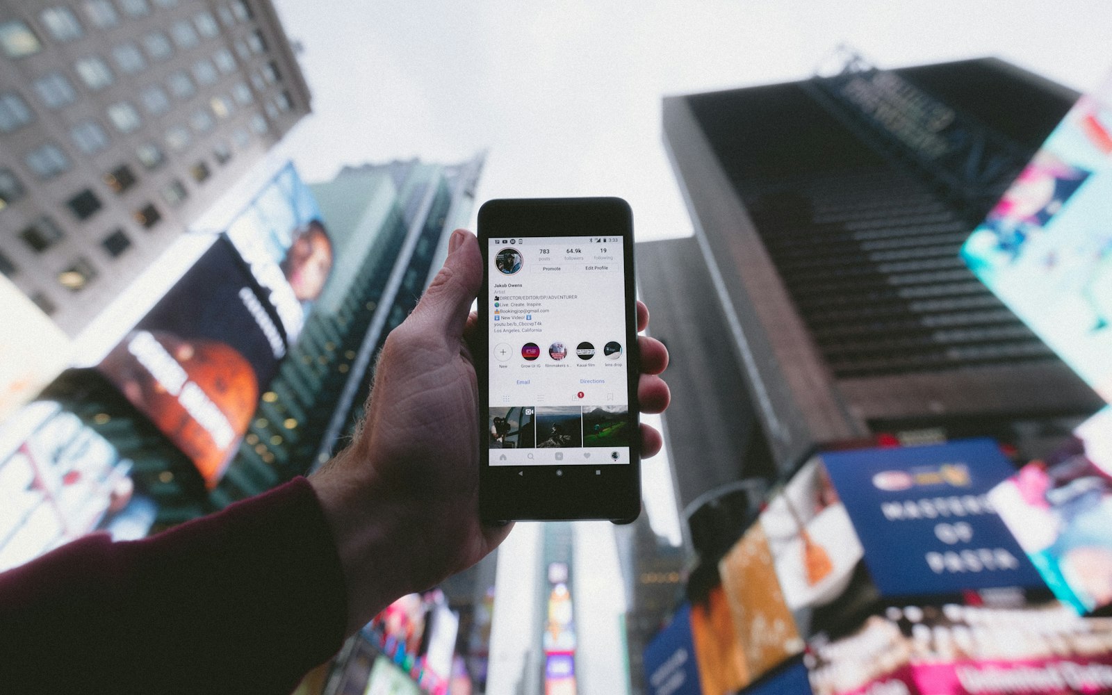 Phone showing a social media feed