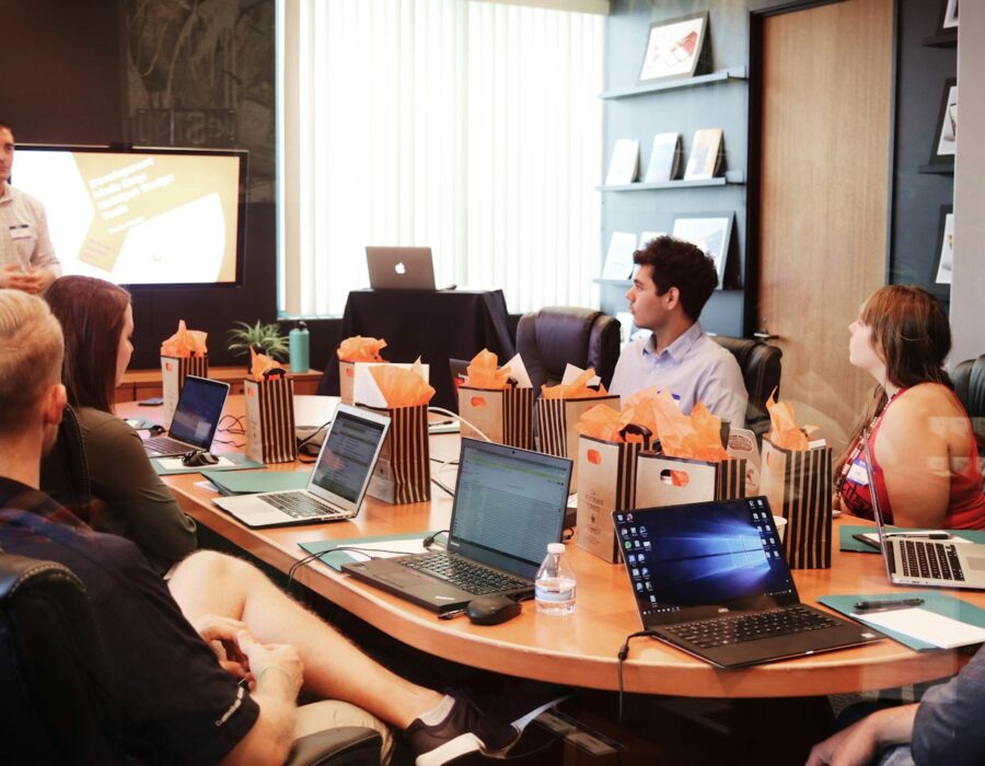 Consultant presenting to a startup team around a table